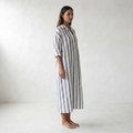 Amaris Linen Long Shirt Dress - model side front - master front reference - Higgsfield job 2a1c4401-269b-40a1-9bd0-568d58e9e0bf